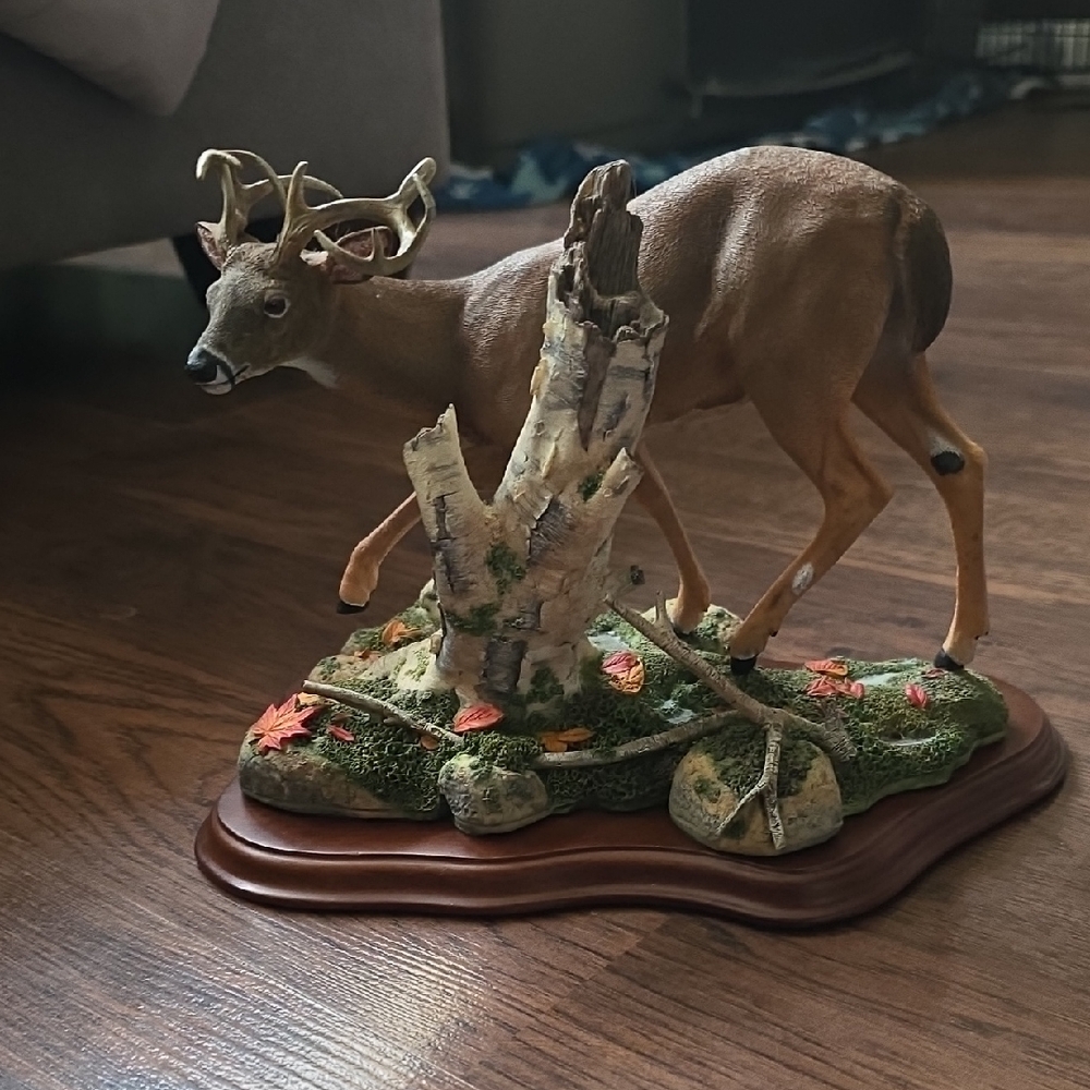 Majestic Deer Sculpture on Wooden Base